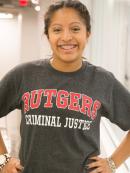 smiling student wears Rutgers Criminal Justice t-shirt