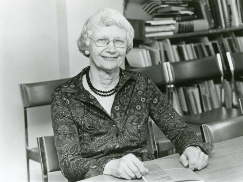 Mary I. Bunting sitting at desk