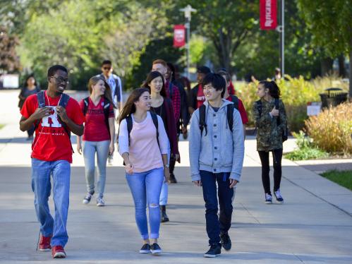 A group of college students works on a campus