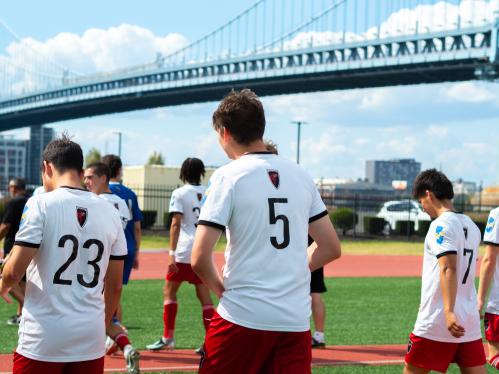 Camden soccer players with Ben Franklin Bridge in background
